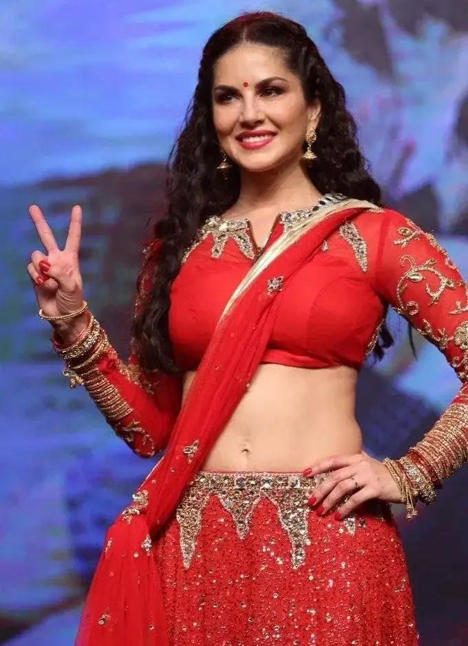 SUNNY LEONE IMAGES IN RED SAREE AT TELUGU MOVIE AUDIO LAUNCH 2